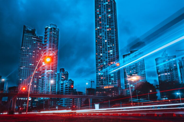 A dramatic long exposure shot showcasing Panama City's skyscrapers and light trails at night.